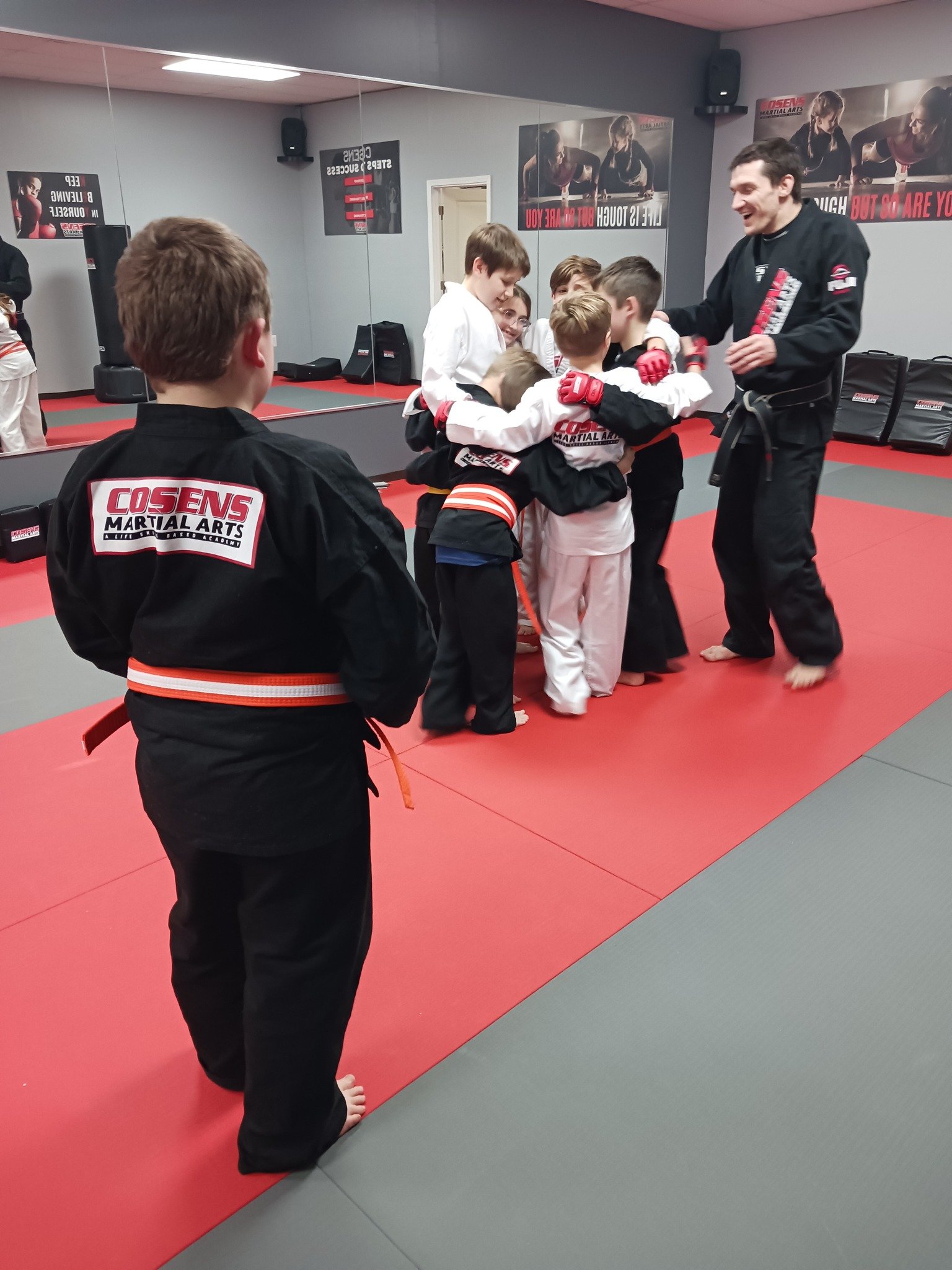 Children learning teamwork in martial arts class in Bad Axe