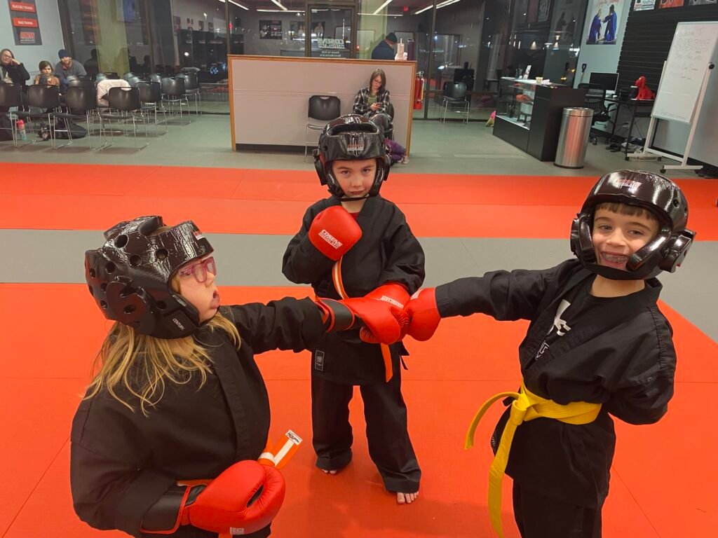 Children practicing focus in a karate class at Cosens Martial Arts Bad Axe